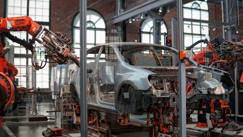 Illustrative photograph of an automobile in an automated manufacturing facility, not the planned Audi Georgia plant