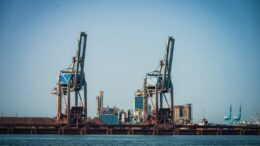 Illustrative image of cranes at an industrial port; not the proposed ST LNG facility