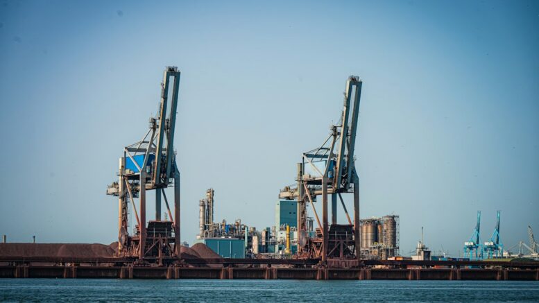 Illustrative image of cranes at an industrial port; not the proposed ST LNG facility