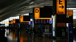 Illustrative photograph of a modern airport terminal interior; not Salt Lake City International Airport
